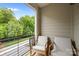 Outdoor balcony with comfortable seating and a scenic view of surrounding trees at 336 Uptown West Dr, Charlotte, NC 28208