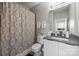 Neat bathroom with decorative shower curtain, neutral color palette, and modern sink at 336 Uptown West Dr, Charlotte, NC 28208