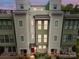 Modern townhouse showcasing neutral siding, and a welcoming entrance at 336 Uptown West Dr, Charlotte, NC 28208