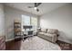Functional home office with a cozy sofa, a large window, and modern desk setup at 336 Uptown West Dr, Charlotte, NC 28208
