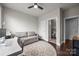 Versatile home office with a comfortable sofa, stylish rug, and functional desk space at 336 Uptown West Dr, Charlotte, NC 28208