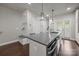Open-concept kitchen design with modern appliances, island and view of foyer area at 336 Uptown West Dr, Charlotte, NC 28208