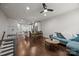 Bright, open living space with hardwood floors, connecting the kitchen and living area at 336 Uptown West Dr, Charlotte, NC 28208