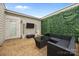 Inviting outdoor patio area featuring modern furniture, an outdoor television, and attractive faux greenery at 336 Uptown West Dr, Charlotte, NC 28208