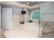 A large bathroom with a soaking tub, glass enclosed shower, tile floors, and modern fixtures at 3504 High Ridge Rd, Charlotte, NC 29270