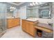 Bathroom with double vanity sinks, granite countertops, tile floors, and a glass-enclosed shower at 3504 High Ridge Rd, Charlotte, NC 29270