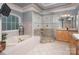 A luxurious bathroom with a soaking tub, walk-in shower, double sinks and tile floors at 3504 High Ridge Rd, Charlotte, NC 29270