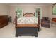 Bedroom with a four-poster bed, two side tables, and sitting chair offer a relaxing space at 3504 High Ridge Rd, Charlotte, NC 29270