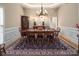 Formal dining room with wooden table, decorative rug, and chandelier at 3504 High Ridge Rd, Charlotte, NC 29270
