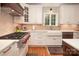 Bright kitchen with white cabinets, apron sink, and stainless steel appliances at 3504 High Ridge Rd, Charlotte, NC 29270