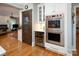 The kitchen features a large double oven, a wine cooler, and access to the living room at 3504 High Ridge Rd, Charlotte, NC 29270