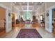 Open living room with hardwood floors, coffered ceilings, and large arched window at 3504 High Ridge Rd, Charlotte, NC 29270