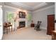 Living room with a fireplace, large windows, carpet, and a comfortable seating area at 3504 High Ridge Rd, Charlotte, NC 29270