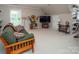 Spacious living room with a comfortable sofa, bright window, and stylish decor for a cozy retreat at 3504 High Ridge Rd, Charlotte, NC 29270