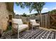 Cozy back patio with comfortable seating and a stylish outdoor rug, perfect for relaxing outdoors at 3528 Colony Rd # A, Charlotte, NC 28211