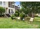 Picturesque backyard with lush greenery, charming seating area, and serene ambiance, perfect for outdoor enjoyment at 3528 Colony Rd # A, Charlotte, NC 28211