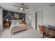 Bright bedroom with modern decor, a black accent wall, and a cozy atmosphere at 3528 Colony Rd # A, Charlotte, NC 28211
