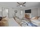 Inviting bedroom with soft lighting, featuring a ceiling fan and stylish decor at 3528 Colony Rd # A, Charlotte, NC 28211