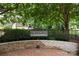 Trianon Condominiums entrance sign with lush landscaping, creating a welcoming atmosphere for residents and visitors at 3528 Colony Rd # A, Charlotte, NC 28211