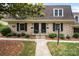 Charming brick townhome featuring a well-manicured lawn and classic architectural details at 3528 Colony Rd # A, Charlotte, NC 28211