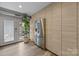 Bright kitchen nook with a stainless steel refrigerator and access to the outdoors at 3528 Colony Rd # A, Charlotte, NC 28211