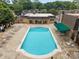 Stunning aerial view of a large community pool with ample lounge seating and shaded areas, perfect for relaxation at 3528 Colony Rd # A, Charlotte, NC 28211
