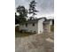 Rear exterior view of the home, highlighting the brickwork and access to the backyard at 3700 Denson Pl, Charlotte, NC 28215