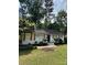 Charming single-story home with a manicured lawn and a classic brick facade at 3700 Denson Pl, Charlotte, NC 28215