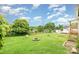 Large backyard offering ample space for recreation, complete with a fire pit and seating area at 380 Woodlawn Ave, Cramerton, NC 28032