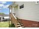 Exterior backyard view with deck access at 380 Woodlawn Ave, Cramerton, NC 28032