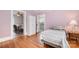 Bedroom featuring hardwood floors with attached kitchen and dining room at 380 Woodlawn Ave, Cramerton, NC 28032