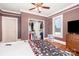 Warm bedroom with hardwood floors, closet, and ceiling fan offers inviting and functional space at 380 Woodlawn Ave, Cramerton, NC 28032