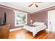 Charming bedroom with hardwood floors, natural light, and cozy ambiance at 380 Woodlawn Ave, Cramerton, NC 28032