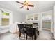 Charming dining area with tiled floors, a wooden table, and adjacent laundry setup, perfect for Gathering meals at 380 Woodlawn Ave, Cramerton, NC 28032