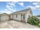 Cozy one-story house with light siding, along with a detached garage, and a beautifully paved driveway at 380 Woodlawn Ave, Cramerton, NC 28032
