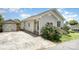 Quaint one-story house with light siding, complemented by a detached garage and a paved driveway at 380 Woodlawn Ave, Cramerton, NC 28032