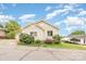 Charming single-story home with vinyl siding and colorful landscaping under a partly cloudy sky at 380 Woodlawn Ave, Cramerton, NC 28032