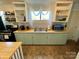 Kitchen with tiled floors, shaker cabinets, and stainless-steel appliances at 380 Woodlawn Ave, Cramerton, NC 28032