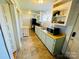 Bright kitchen with tiled floors, shaker cabinets, and stainless-steel appliances at 380 Woodlawn Ave, Cramerton, NC 28032