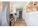 Galley kitchen with stainless steel appliances, ample cabinet space, and a sleek gray accent door at 380 Woodlawn Ave, Cramerton, NC 28032