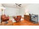 Comfortable living room featuring hardwood floors, floral furniture, and an open layout at 380 Woodlawn Ave, Cramerton, NC 28032