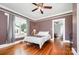 Bedroom featuring hardwood floors, natural light and fresh paint at 380 Woodlawn Ave, Cramerton, NC 28032