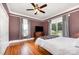 Bedroom featuring hard wood floors, ceiling fan and natural light at 380 Woodlawn Ave, Cramerton, NC 28032