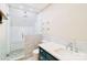Modern bathroom featuring a glass-enclosed shower, stylish vanity, and stone accents at 3921 Bon Rea Dr, Charlotte, NC 28226