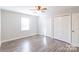Neutral bedroom with ceiling fan and a large window at 3921 Bon Rea Dr, Charlotte, NC 28226