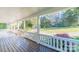 Inviting front porch with wooden floors and a view of the landscaped yard at 3921 Bon Rea Dr, Charlotte, NC 28226