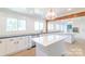 Spacious kitchen with a large center island, white cabinetry, and wooden accents at 3921 Bon Rea Dr, Charlotte, NC 28226