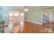 Open-concept space with hardwood floors connecting the living area to the kitchen at 3921 Bon Rea Dr, Charlotte, NC 28226