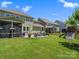 Wide backyard view with patio, screened porch, and play area, perfect for Gathering enjoyment at 4013 Hamilton Mill Dr, Waxhaw, NC 28173
