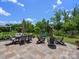 Spacious backyard patio with outdoor dining and seating areas, perfect for entertaining at 4013 Hamilton Mill Dr, Waxhaw, NC 28173